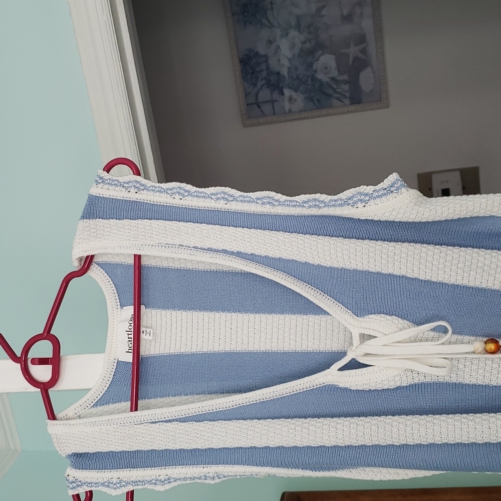 A white and blue cover up- dress.